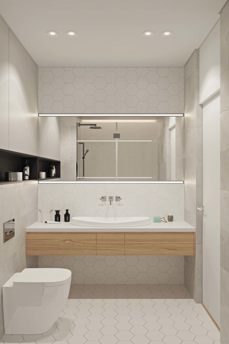 In deze kleine badkamer is er gekozen voor heel veel maatwerk. Naast een praktisch nisje in de muur en een op maat gemaakte zwevende badkamermeubel, is ook de grote spiegel boven de wastafel op maat gemaakt. Klik hier voor meer foto's.