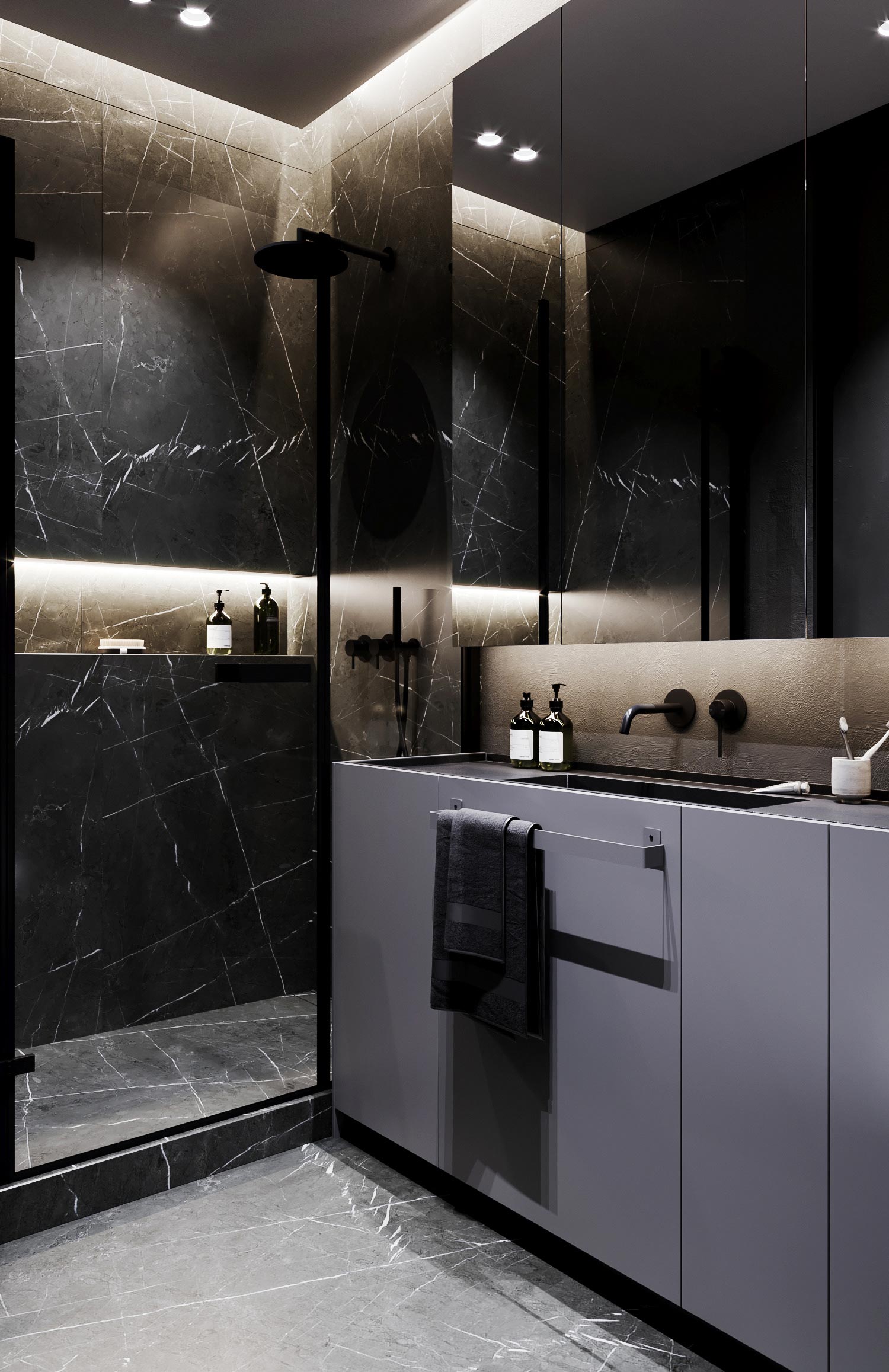 Dit ontwerp laat zien dat een zwarte vloer ook heel mooi kan uitpakken in een kleine badkamer. De zwarte marmeren tegels geven de badkaemr een hele chique look, vooral in combinatie met de verlichting.