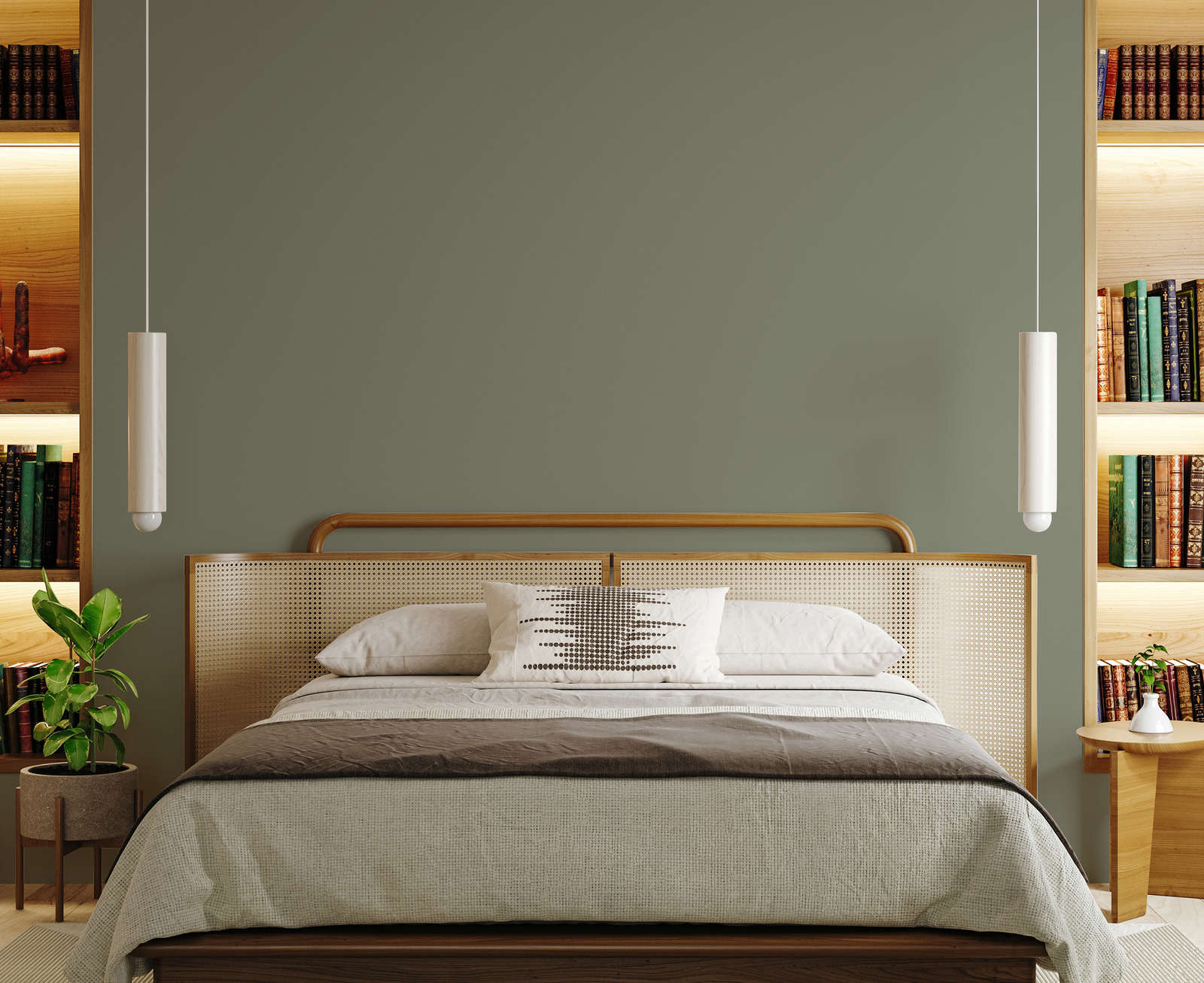 Deze mooie vintage stijl slaapkamer combineert houten kasten, een vintage cane webbing bed met een prachtige olijfgroene muur, geverfd met de New Walls muurverf Persuasive Olive Green.