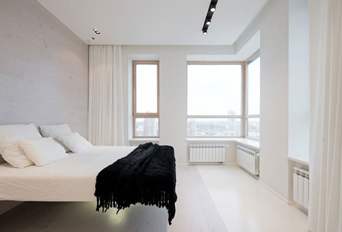 Minimalistische witte slaapkamer